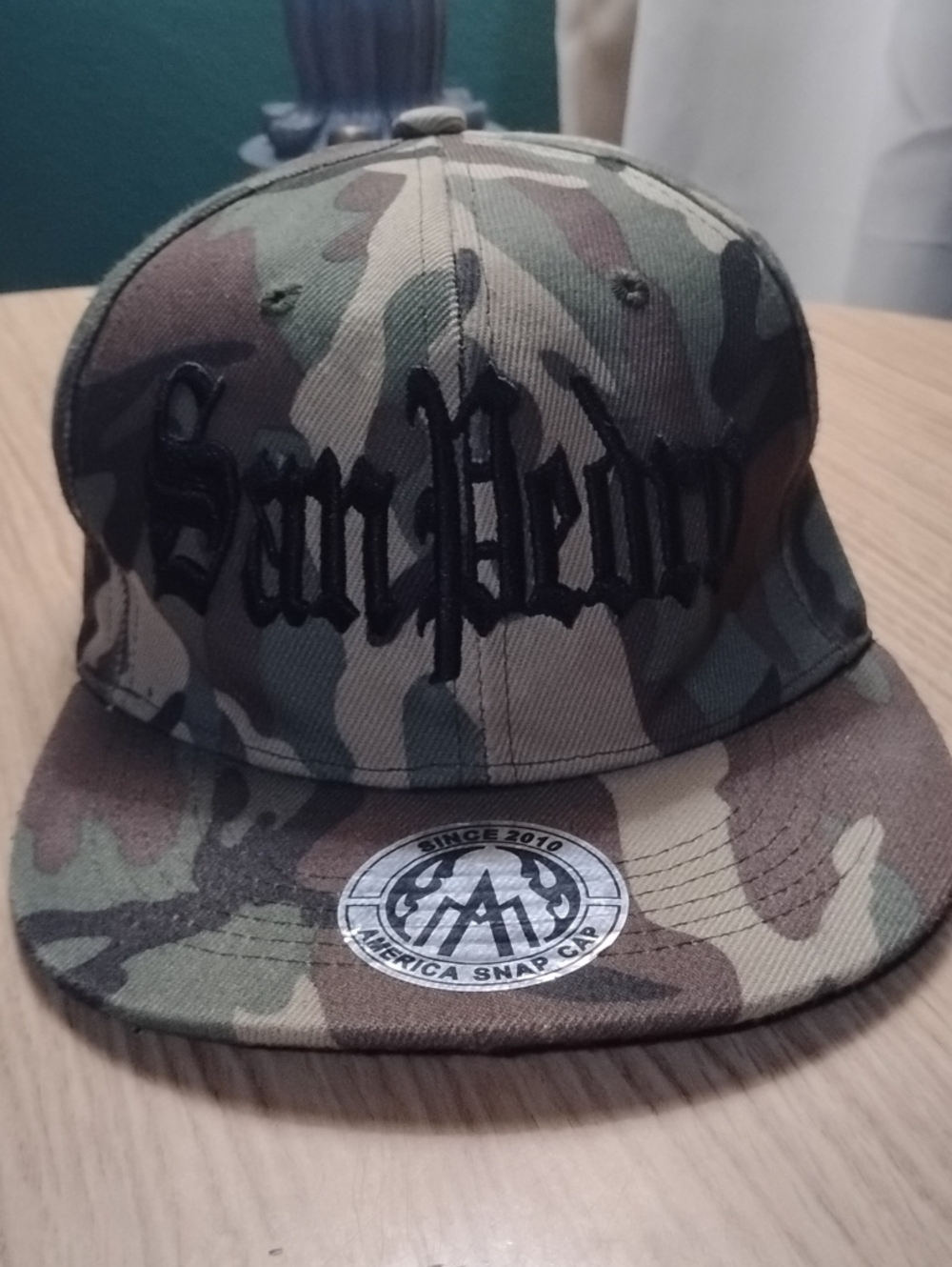 Camouflage Snapback Hat with Black Embroidered Script